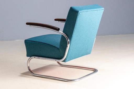 Par de sillones tubulares modelo S 411, mediados del siglo XX.