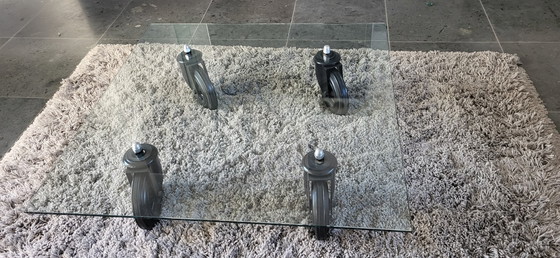 Image 1 of Glass coffee table with black wheels