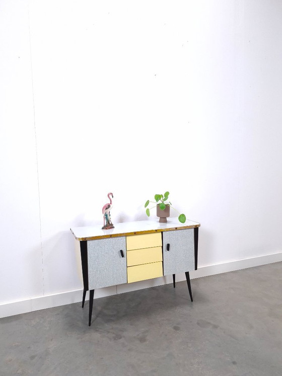 Image 1 of 1950s light blue-yellow cabinet with Formica and slanted legs