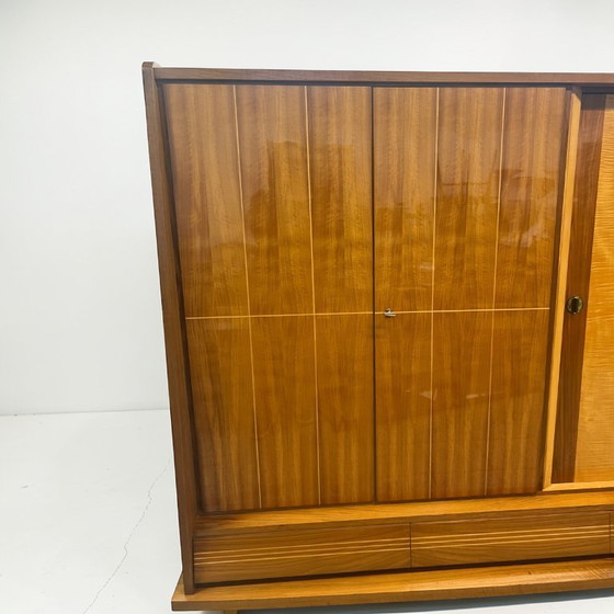 Image 1 of Exclusieve Duitse vintage barkast/woonkamerkast uit de jaren 50, hout in Riva-bootstijl.