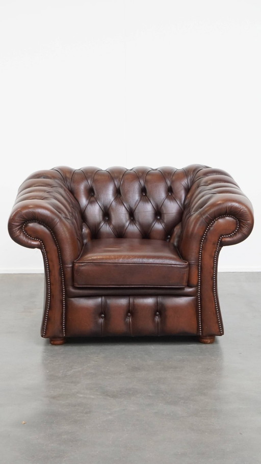 In good condition, cowhide leather chesterfield club chair in English style