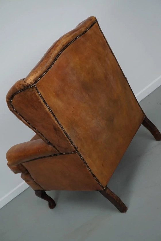 Image 1 of Vintage Nederlandse cognackleurige leren clubfauteuil met voetenbank