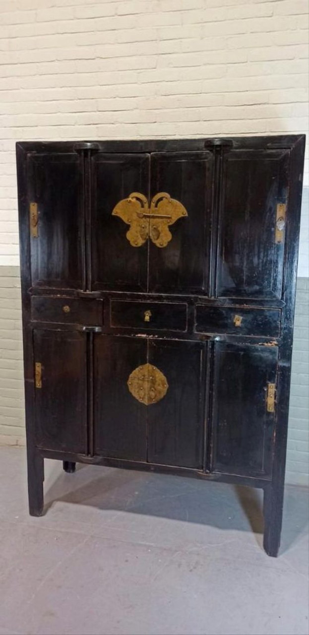 Vintage black lacquered and brass cabinet