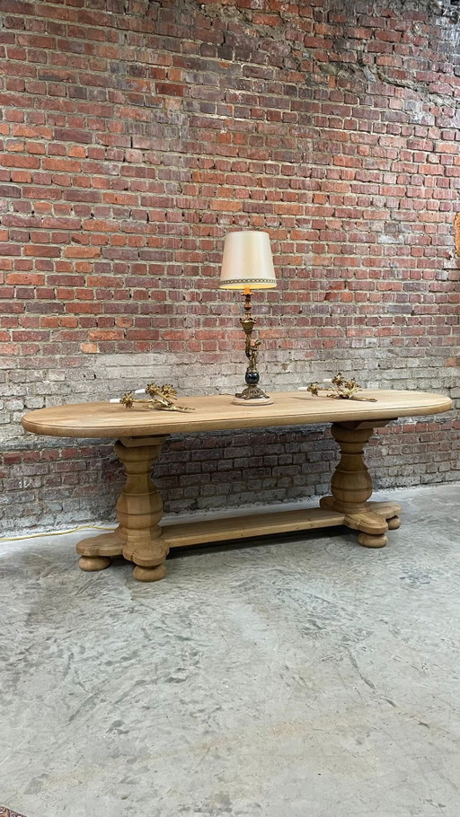 Solid oval monastery table of bleached oak with turned legs
