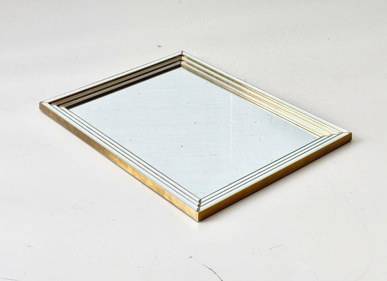 Image 1 of Wall mirror in a frame encased in beveled mirror glass
