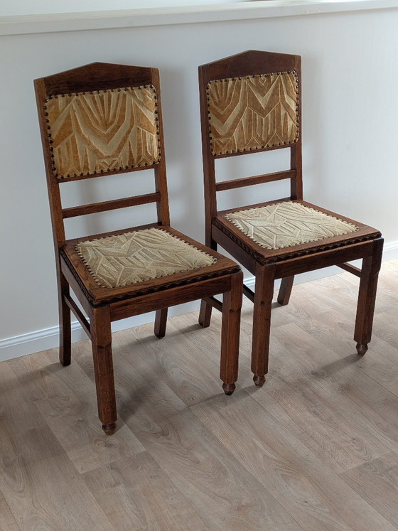 Image 1 of Een paar art-deco eetkamerstoelen van de Amsterdamse School – eikenhout en velours (jaren 1920/1930)