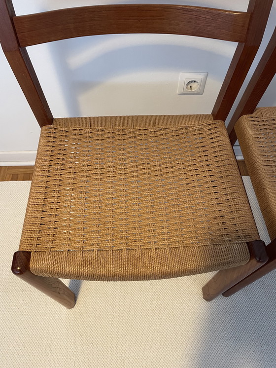 Image 1 of 4 stoelen in mid-century stijl uit de jaren 60, gemaakt van teakhout en riet.