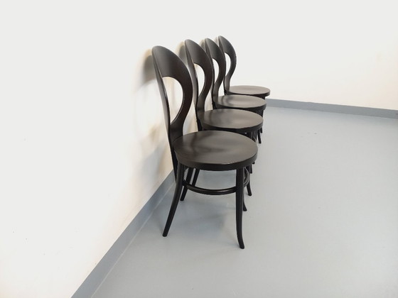 Image 1 of Set van 4 vintage Baumann Mouette stoelen in zwart hout uit de jaren 70.