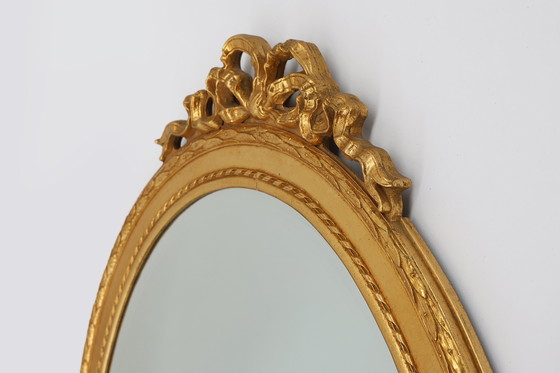 Image 1 of Oval shaped carved gilded Baroque mirror with beveled glass, Belgium  