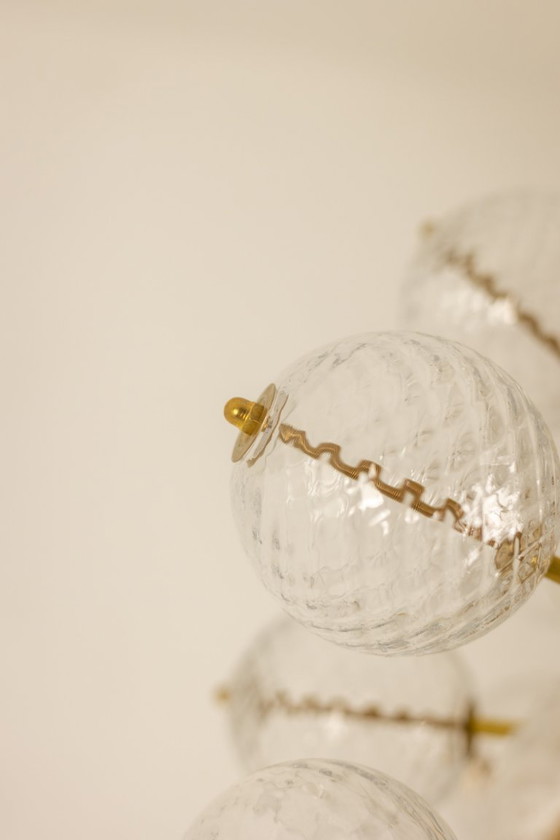 Image 1 of Kamenicky Senov, editor. Pair of brass and glass chandeliers. Circa 1970