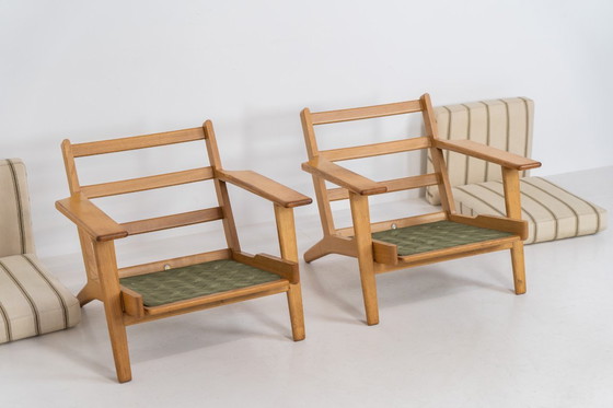 Image 1 of Pair of Early GE-290 lounge chairs in oak by Hans J. Wegner for Getama (Denmark, 1953).