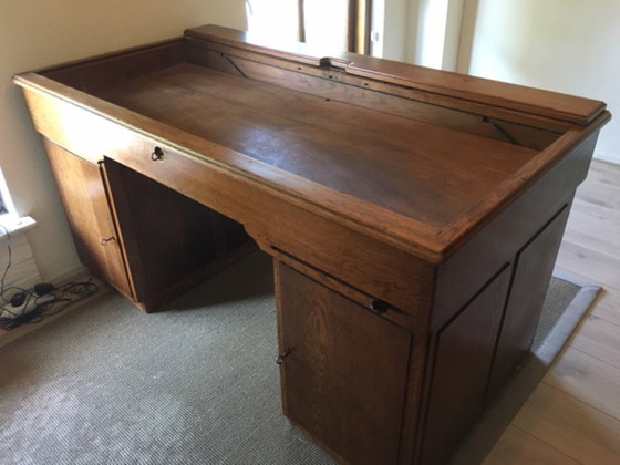 Image 1 of Eiken bureau met in/uitschuifbaar bovenblad