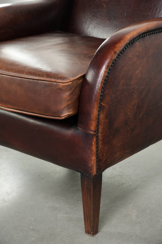 Image 1 of Poltrona di design in pelle di pecora in buone condizioni, con un bellissimo colore intenso e una seduta confortevole.