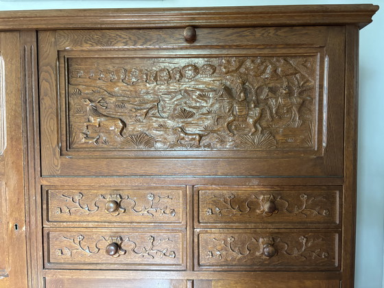 Image 1 of Antique oak secretary hunting cabinet with unique wood carving