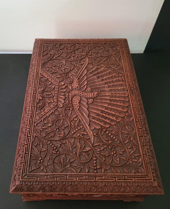 Image 1 of Hand-engraved wooden jewelry box with peacock and floral motifs.