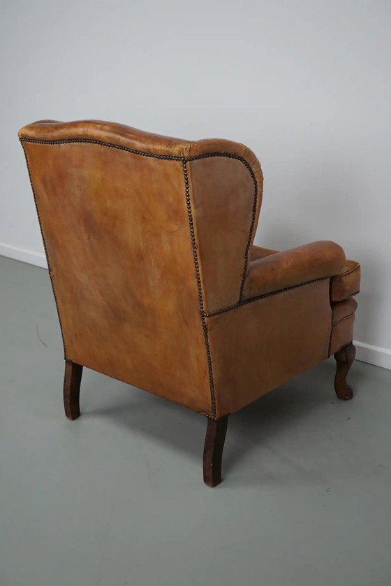 Image 1 of Vintage Nederlandse cognackleurige leren clubfauteuil met voetenbank