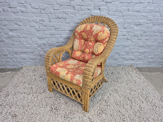 Image 1 of Luxurious Vintage Bamboo & Rattan Armchair with Floral Cushions – Warm Terracotta Tones