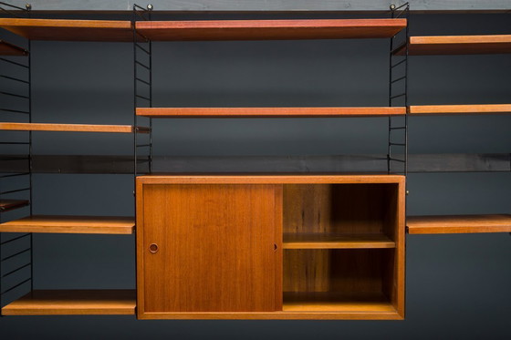 Image 1 of Modulaire wandplank in teak van Nils Strinning voor String, 1960, set van 29
