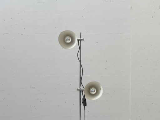 Stijlvolle vloerlamp in mid-century stijl met twee verstelbare lampkoppen.