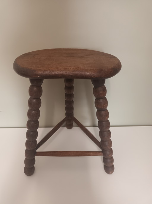 Wooden stool with turned legs