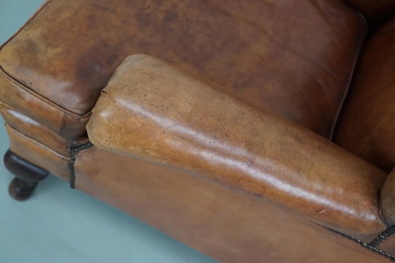 Image 1 of Vintage Nederlandse cognackleurige leren clubfauteuil met voetenbank