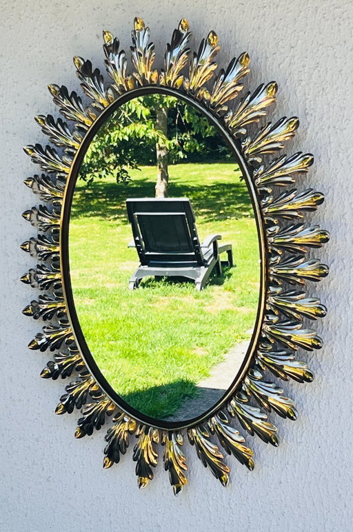 Miroir ovale décor feuilles en métal