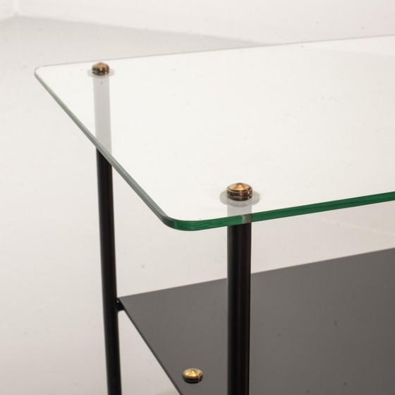 Image 1 of Mid-Century Pierre Guariche Glass Coffee / Side Table for Airborne in Black Steel with Brass Magazine Holder. France, 1950s. 