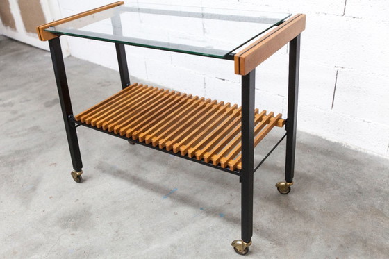 Image 1 of Serveerwagen uit de jaren 60, hifi-kast op wieltjes in teakhout, zwart metaal en glazen blad.