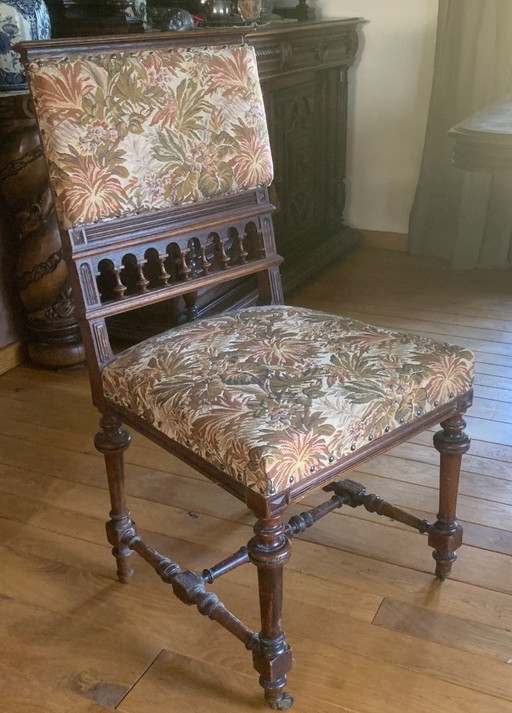 Antique, oak extendable table and 8 matching chairs on casters
