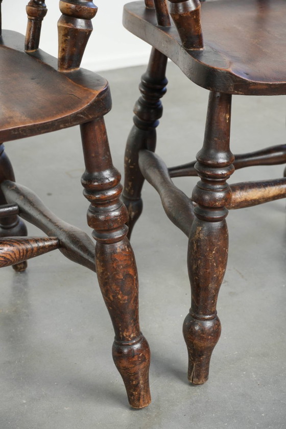 Image 1 of 4 x Antique wooden English pub/captain chairs from the late 19th century with character