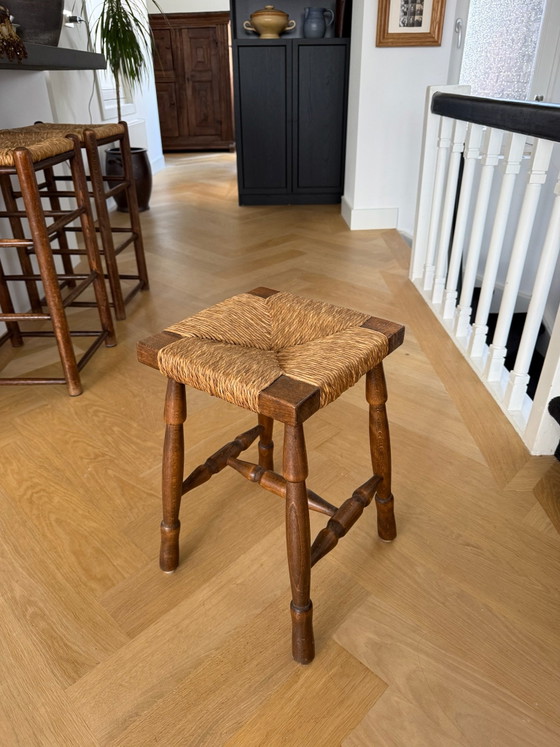 Vintage wooden stool with wicker seat (photo 3 of 5)