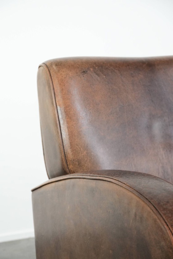 Image 1 of Vintage schapenleren armchair met een ronde vormgeving 