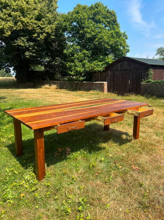 Image 1 of Dining table in American walnut and maple. Handcrafted solid wood extensions and drawers. Live edge for visual depth. Epoxy resi