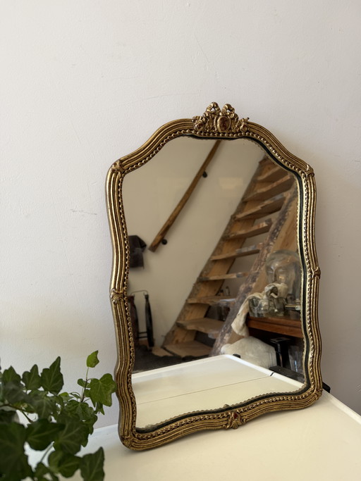 Specchio vintage degli anni '20 con cornice color oro