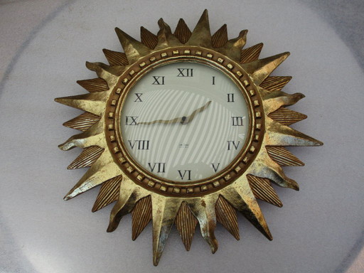 Karlsson Sun clock gilt 22k gold heavy wall clock from late 20th century works fine.