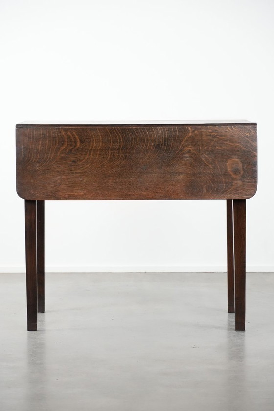 Image 1 of Antique English drop-leaf side/dining table made of oak from the 19th century with a drawer.
