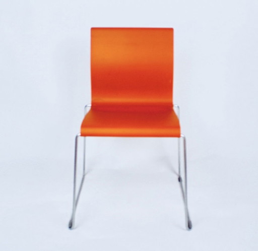 Large series of Bla Station Sting chairs in black, orange and white.
