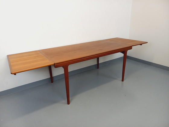 Image 1 of Scandinavian rectangular vintage dining table by Johannes Andersen for Samcom from the 60s in teak with integrated extensions