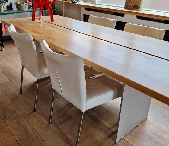 Image 1 of 4 dining room chairs upholstered in white leather