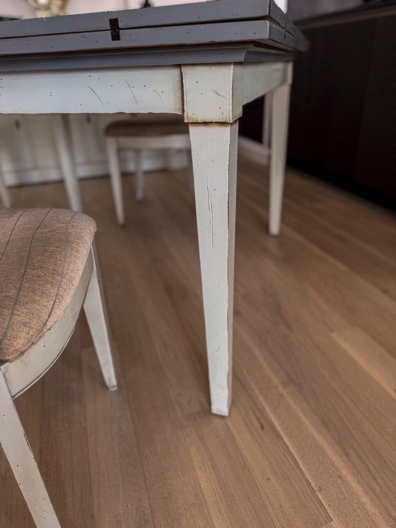 Image 1 of Handkerchief table with 4 leaves and 4 chairs