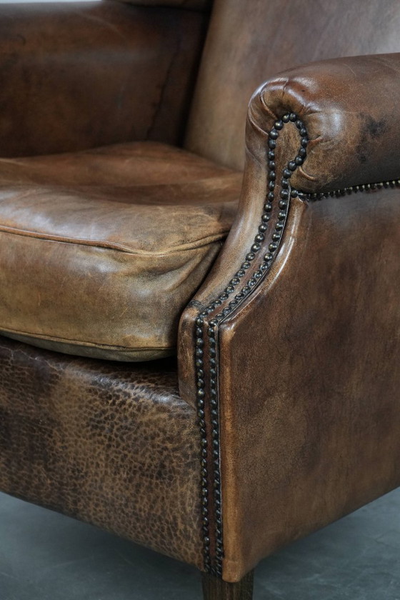 Image 1 of Comfortable vintage sheepskin wing chair with character