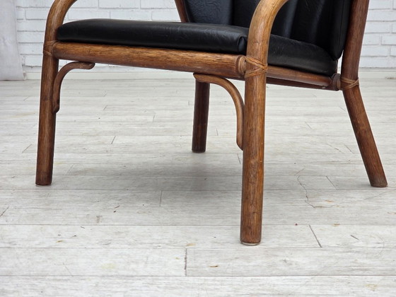 Image 1 of 1970s, Danish armchair, rattan, black artificial leather.