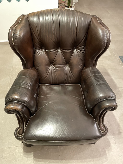 Chesterfield-style wingback armchair