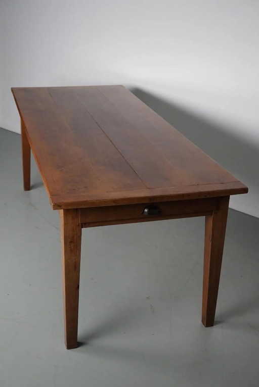 Antique cherry wood French rustic farmhouse dining table from the early 20th century