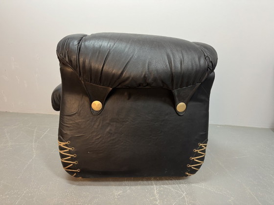 Image 1 of Beautiful Big Black Leather Postmodern Italian Design Space Age Lounge Chair with Brass Buttons and Playful Cord Lacing, 1970s.