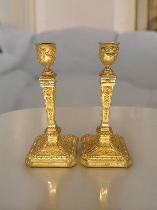 Pair of 19th-century gilt and chased bronze Louis XVI style candlesticks