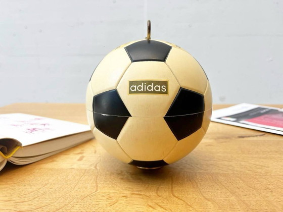 Image 1 of Vintage Adidas cigarette dispenser from the 1970s