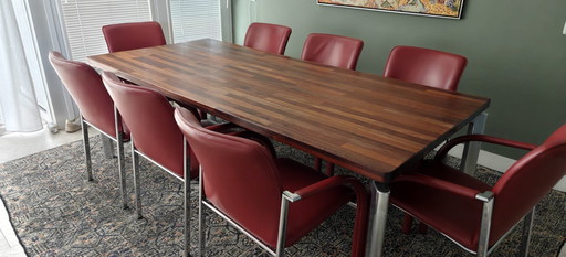 Leolux dining table with 8 matching leather Leolux chairs