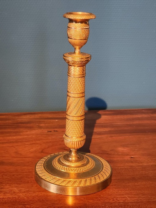 2 Bronze gilded Empire candlesticks.