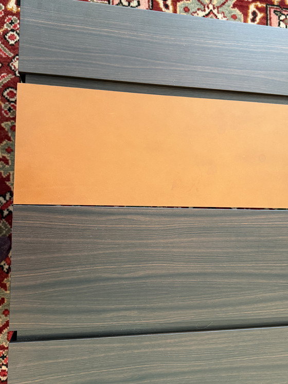 Image 1 of Custom-made, asymmetrical coffee tables (twin) of Macassar wood with orange calfskin details.